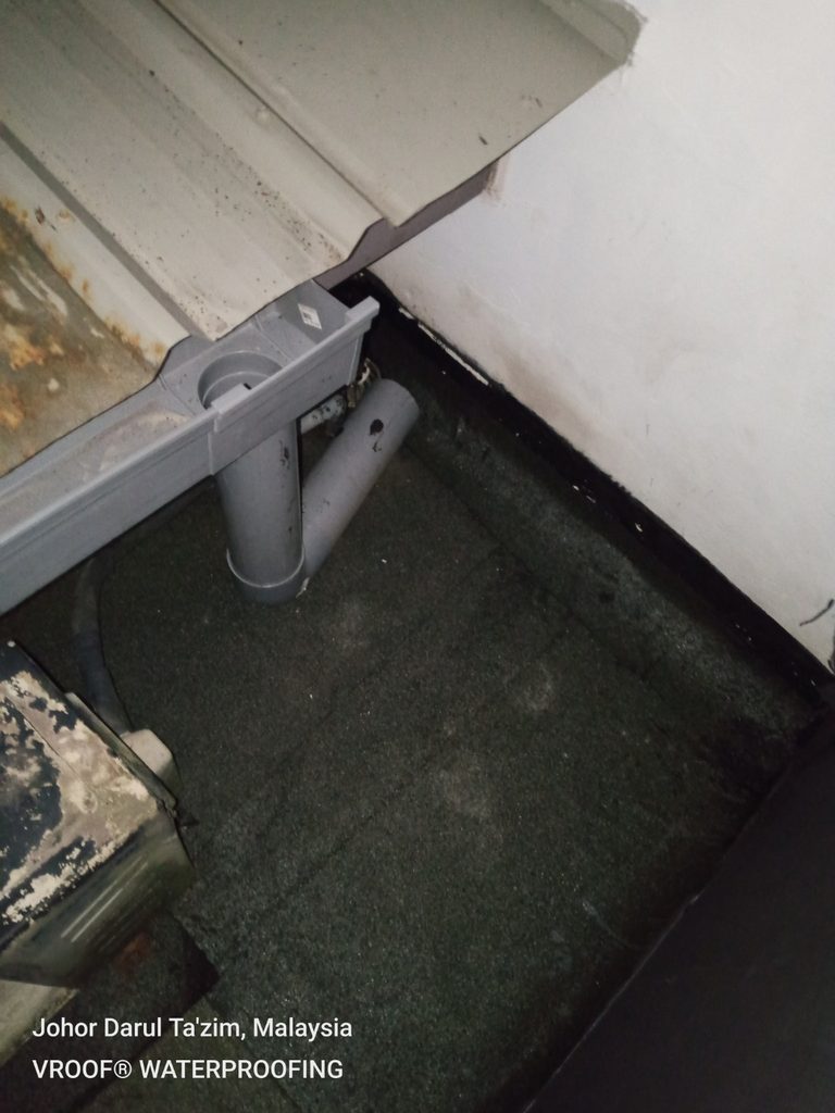 New rain gutter and downpipe installed at Cascadia to redirect roof runoff away from the repaired waterproofing area.